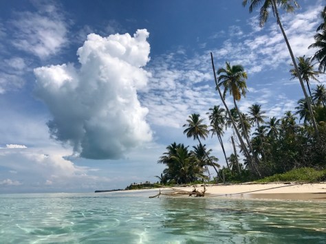 Eating coconuts, thunderheads drift by, Solo Kayaking, Kayaking, Banyak Islands, island paradise, paradise, beach, perfect beach, camping, Sumatra, Indonesia,